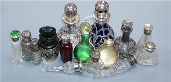 Fourteen assorted late 19th/early 20th century silver or white metal mounted glass small scent bottles